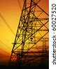 stock photo : Electricity Pylon over orange sunset sky. 
Environmental damage