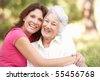 stock photo : Senior Woman With Adult Daughter In Park