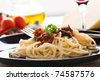 stock photo : Spaghetti with tomato sauce, capers and anchovies. spaghetti with tomato sauce .