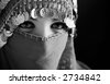 middle eastern culture: belly dancer with traditional veil - stock photo