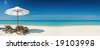 صور شواطىء وبحار  Stock-photo-panoramic-view-of-two-chairs-and-white-umbrella-on-the-beach-banner-lots-of-copy-space-19103998